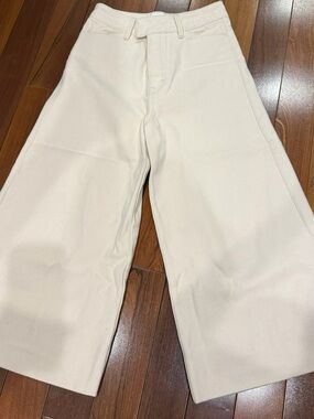 REMAIN Birger Christensen. Below knee Wide-Leg Flare Jeans in Cream